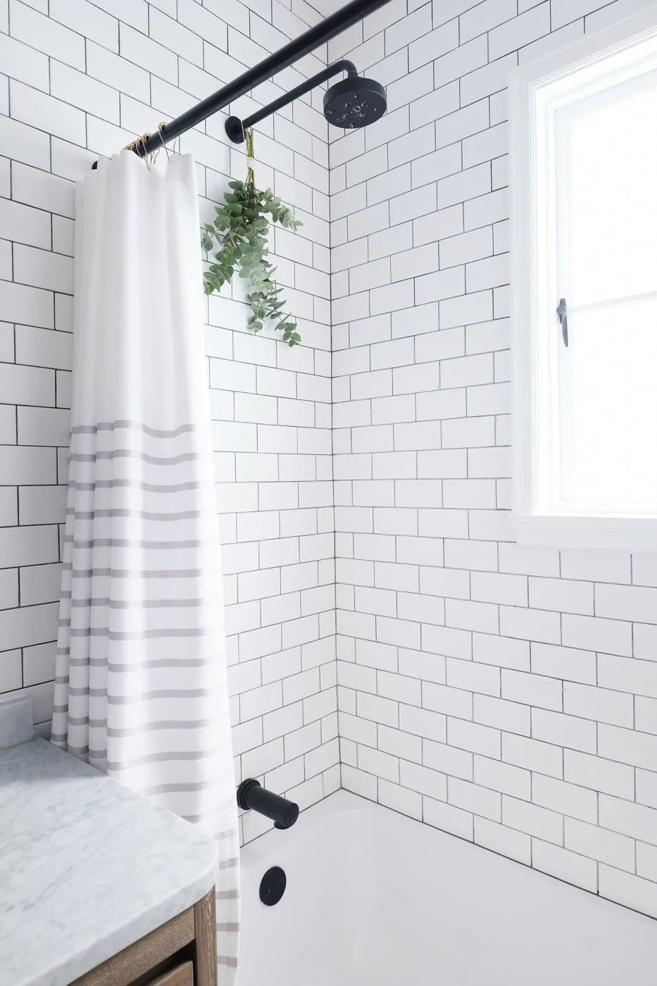 Beautiful all white designer bathroom flooring tiles & tiling design with a window and a small plant