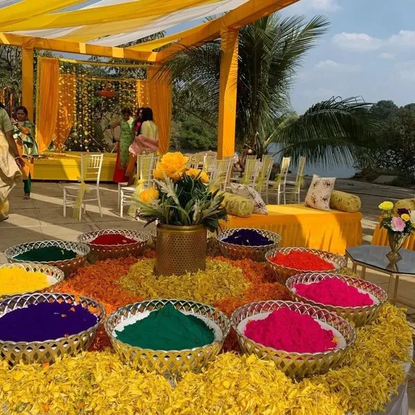 Colourful rangoliwith urlis for traditional DIY Haldi decoration