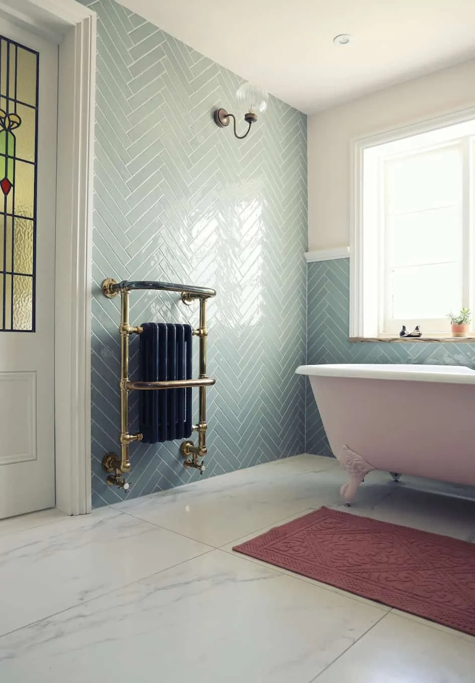 Light textured washroom with a red mat