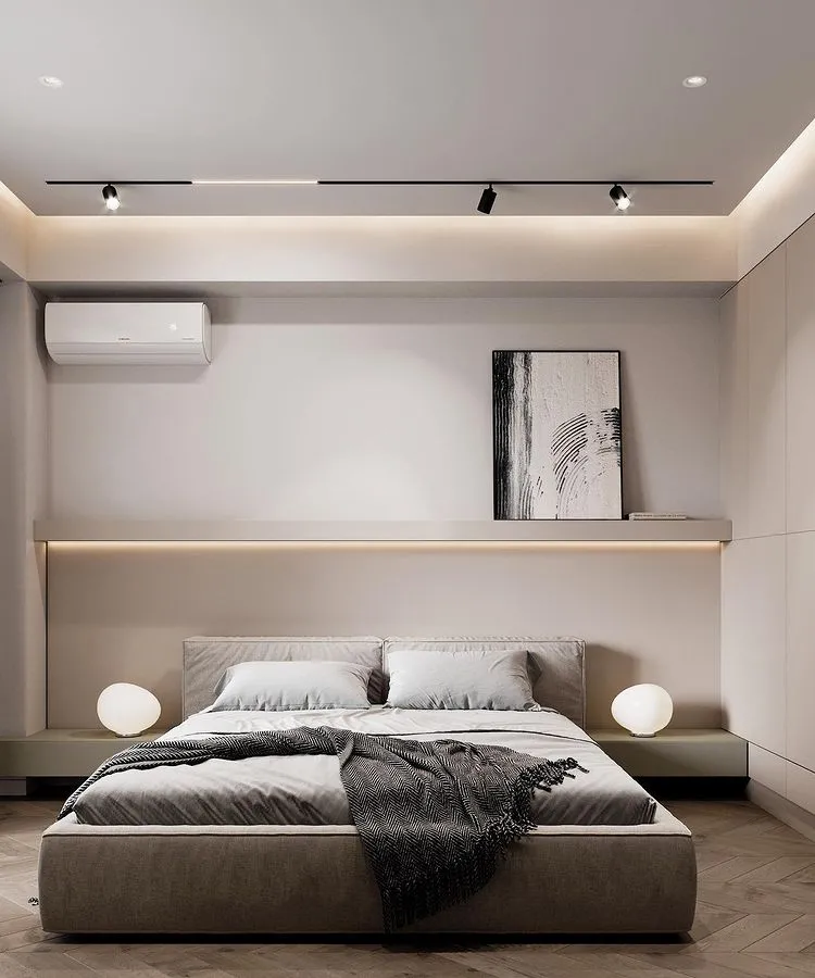 white bedroom with bed, shelf, white table lamps, ceiling lights and AC