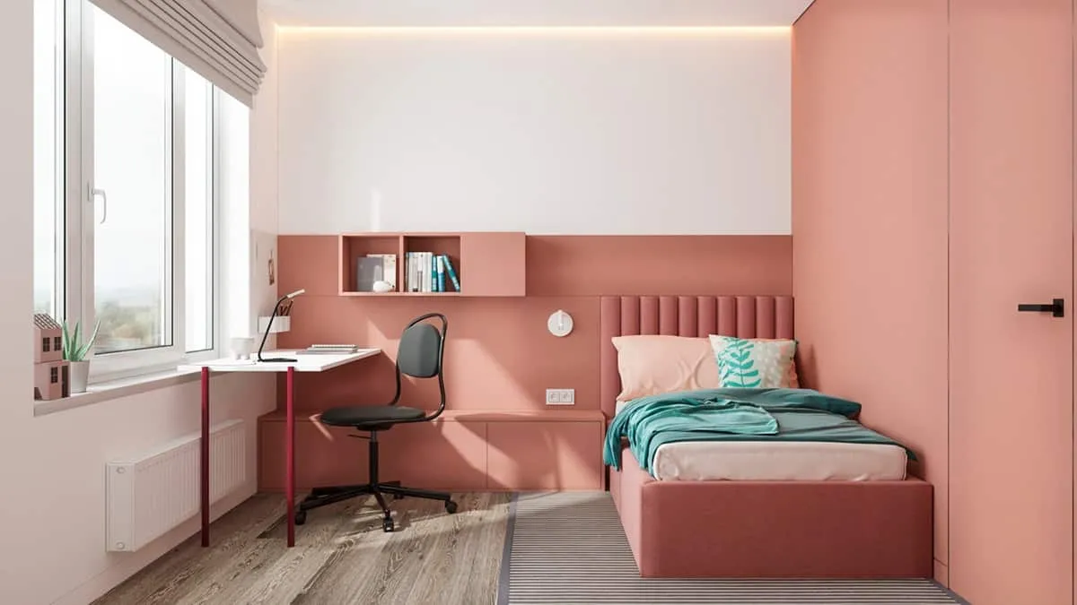 pink bedroom with a table, chair and carpet