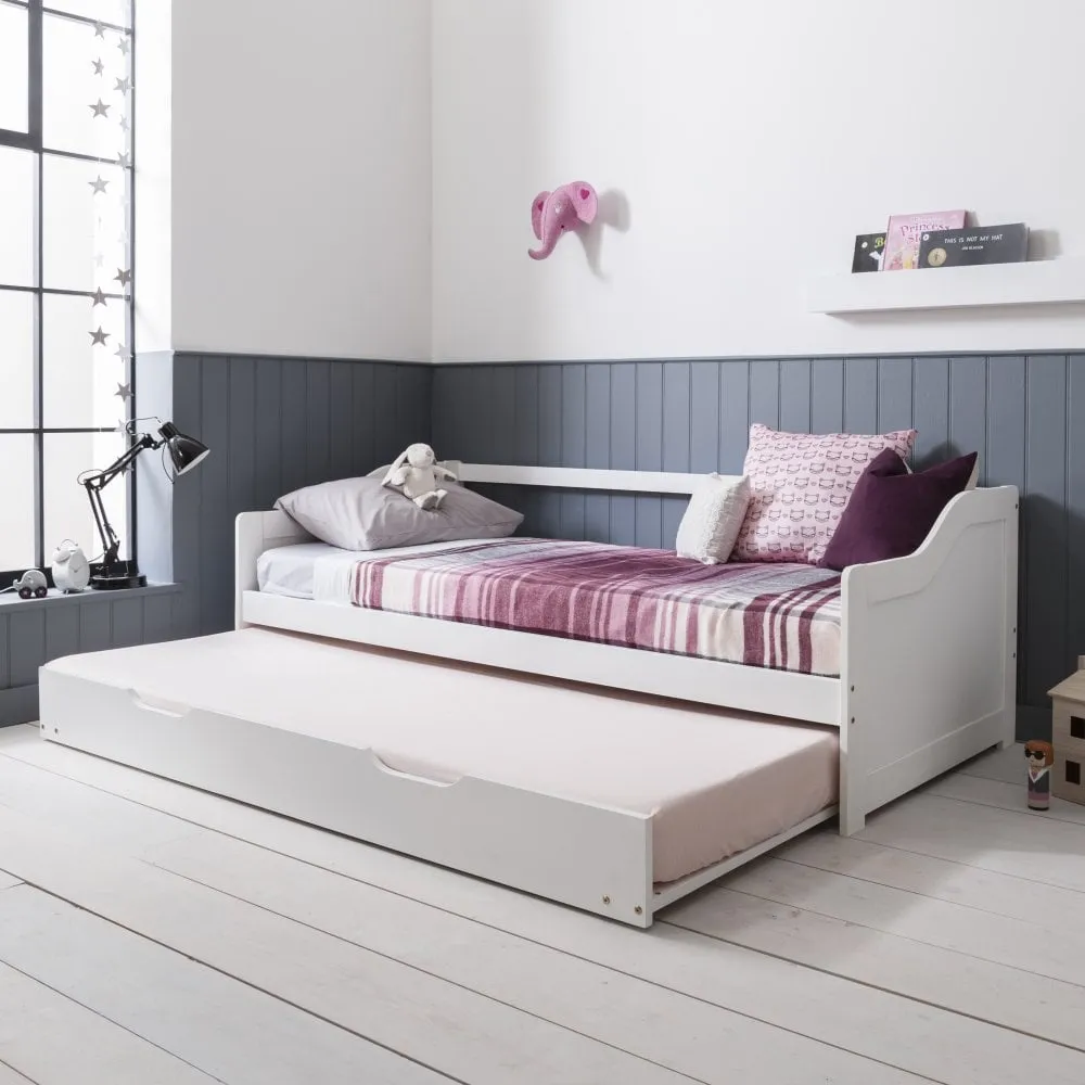 white trundle in a bedroom with dual toned walls