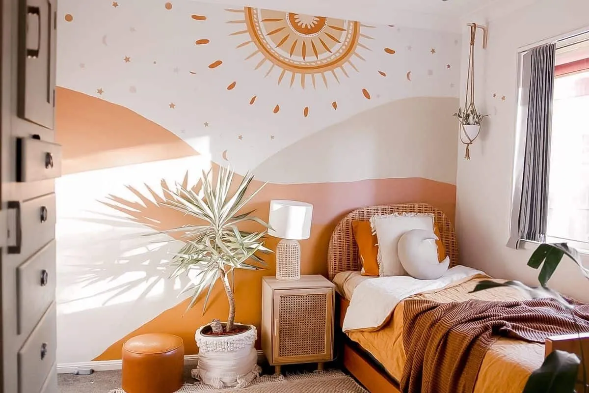 A beautiful bedroom with a wall paint design idea on the wall a bed a lamp and plant.