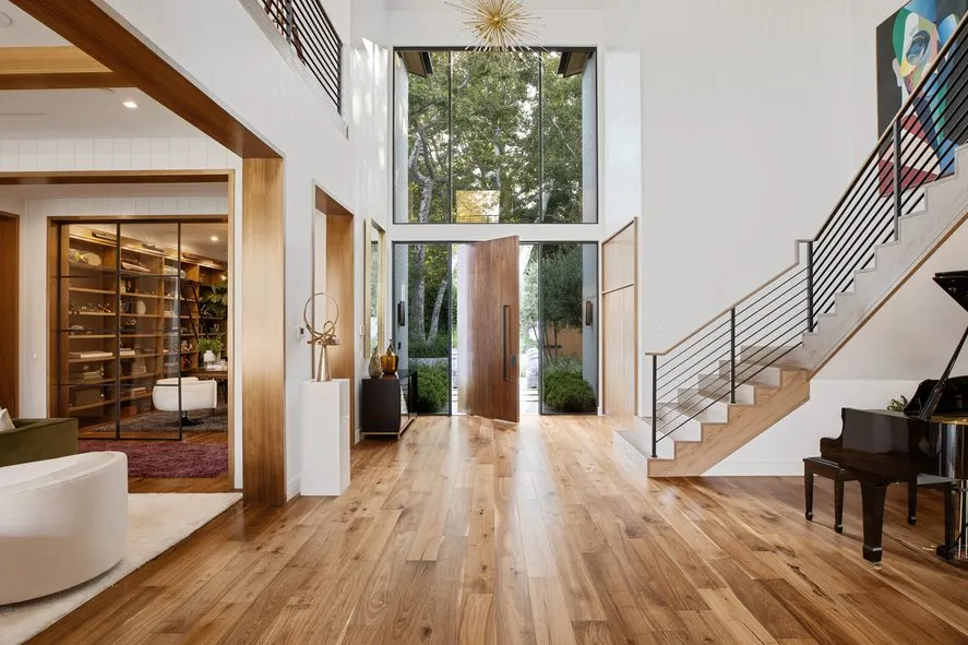 brown wooden entrance gate with wooden floors, stairs in a hallway