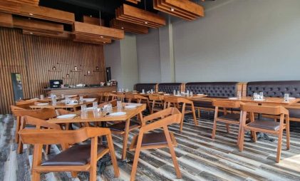 Celesto Bar & Restaurant interiors with wooden furniture made from canadian wood species by minimal stroke & wings design studio - top design firms in indian hospitality sector