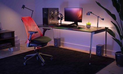 dynamic gaming chair with gaming setup in a room, table, PC gaming chair, vibrant lights added gaming vibe