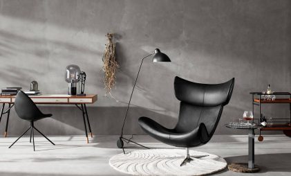 black modern leather chair, placed in classic living room, accent black metal lamp, chair placed on rug