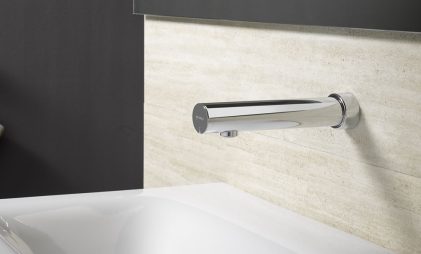 silver SCHELL sensor tap in a washroom with white washbasin