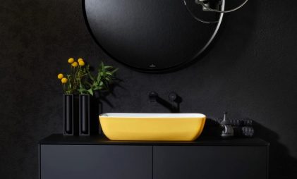 villeroy & boch ARTIS - yellow countertop washbasin mounted on matte black vanity in a modern black bathroom