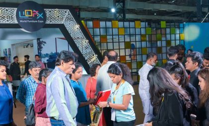 WOFX international furniture expo attended by mechants, manufacturers and buyers from the global market with a crowd of people at the entrance hall with brown flooring