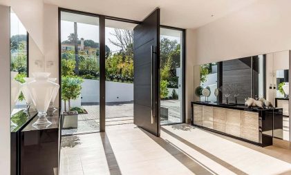 modern front door design, black colored steel pivot door