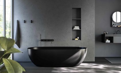 black coloured coloured bathtub in a luxury bathroom with grey walls