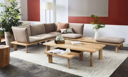 minimalist theme living room with brown coloured wooden sofa set with pillow-like cushions inspired by Japanese zaisu on a modular platform of natural wood