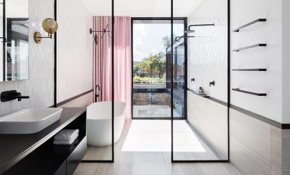 modern and minimalistic bathroom design with sliding glass doors, bathtub, and matte black bathroom fittings and accessories