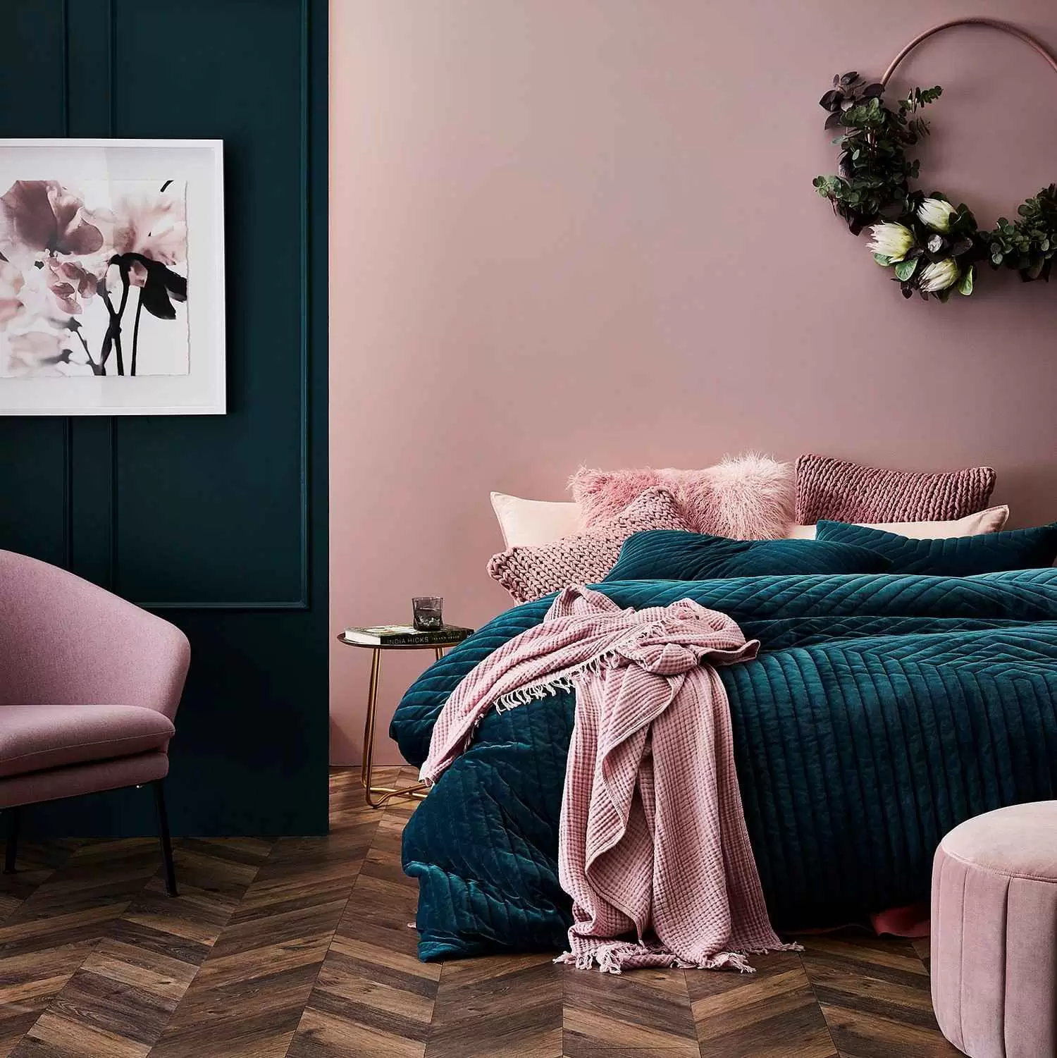 pink and blue wall paint with bed, chair and painting