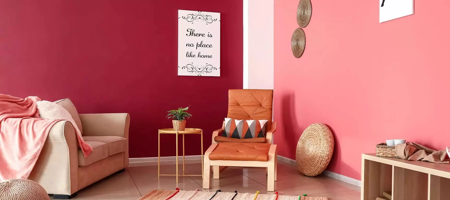 maroon and pink walls in a living room with chair, table, sofa